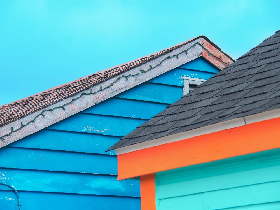Painted lap siding on the gables of two homes
